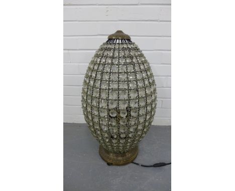 A contemporary table lamp having an acorn shaped cut glass shade. 65cm 