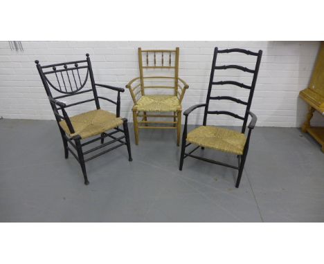 A collection of three Arts & Crafts Sussex-type ladder back open arm chairs (a/f).