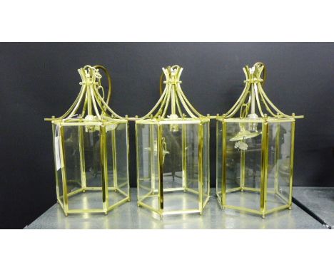 A set of three hexagonal shaped brass and glass panelled hall lantern style light fittings (3) 