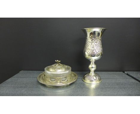 An Epns and glass circular butter dish, the lid with rose spray finial together with a floral repousee goblet (2) 