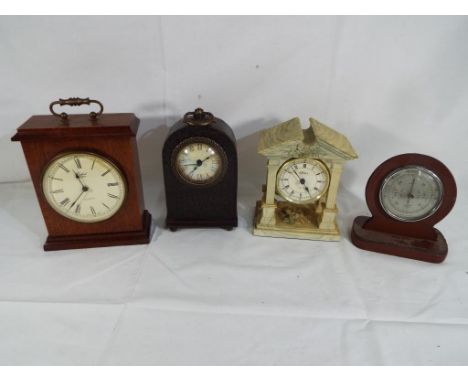 Three clocks and a barometer