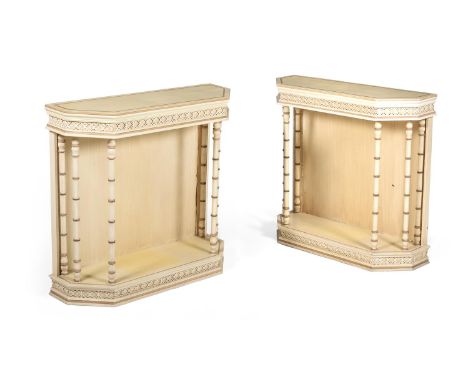 A PAIR OF CREAM PAINTED SIDE OR CONSOLE TABLES IN THE MANNER OF OLIVER MESSEL, LATE 20TH CENTURY  each 89cm high, 96cm wide, 