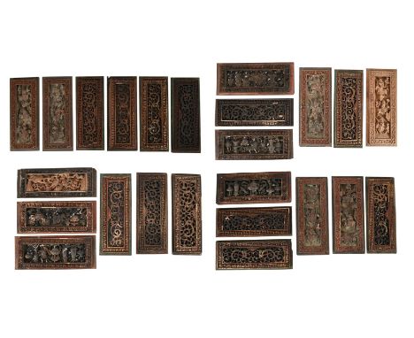 A SET OF TWENTY FOUR CHINESE CARVED PANELS 19TH CENTURY Centre sections carved with  various motifs, few examples with residu
