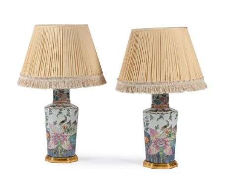 A PAIR OF CERAMIC LAMPS DECORATED IN THE 'TOBACCO LEAF' PATTERN  CONTEMPORARY  Four light fitments, set on gilt wood bases  8