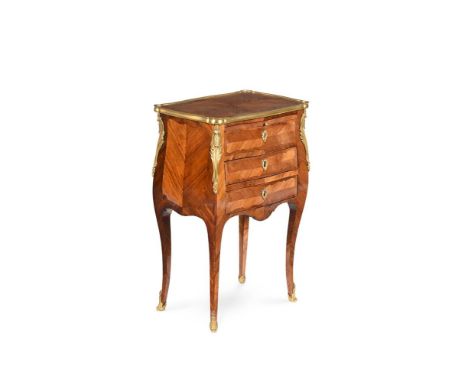 Y  AN EARLY LOUIS XV KINGWOOD, TULIPWOOD AND ORMOLU MOUNTED TABLE A ECRIRE OR WRITING TABLE CIRCA 1735  With leather inset sl