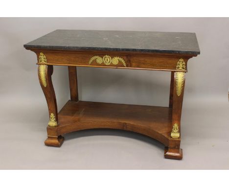 AN EARLY 19TH CENTURY EMPIRE MARBLE TOPPED CONSOLE TABLE. With a broad rectangular black marble top above a swept frieze with