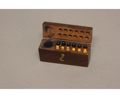 AN UNUSUAL EARLY 19TH CENTURY BOX OF CHESS STAMPS. The small mahogany box with an ink pad and twelve 'stamps', six in ebony, 