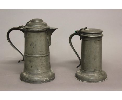 A LARGE 18TH CENTURY PEWTER 'UNION SOCIETY' JUG AND ANOTHER. The large lidded jug with a domed cover, the straight sided body