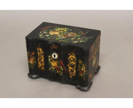 A REGENCY OR EARLY VICTORIAN LACQUERED TEA CADDY. With a moulded front and flat top all over decorated with gilding and paint