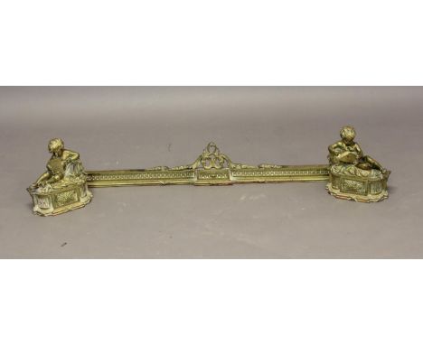 A 19TH CENTURY FRENCH GILT BRASS FIRE KERB. Of neo classical design with central raised scrolling detail on a ribbon tied mou
