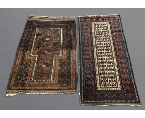 BALUCH RUG, KHORASAN EAST IRAN, CIRCA 1900 The compartmentalised diamond lattice camel ground enclosed by reciprocal arrow he