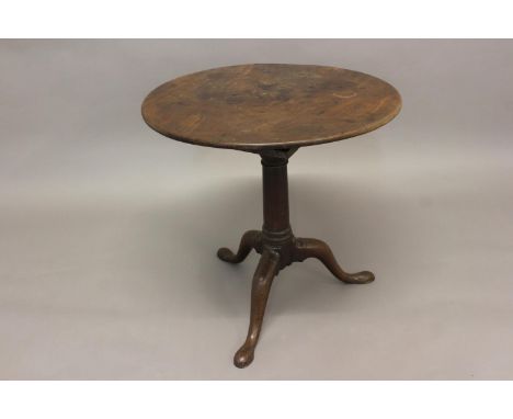 A GEORGE II MAHOGANY 'BIRD CAGE' TRIPOD TABLE. With a circular one piece revolving top on a 'birdcage' base with four turned 