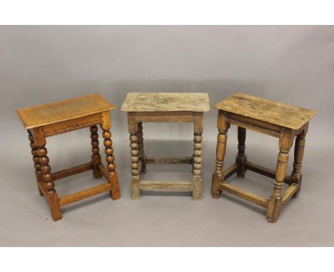A PAIR OF REPRODUCTION JOINT STOOLS AND ANOTHER. Three reproduction joint stools by Stuart Interiors, a pair with rectangular