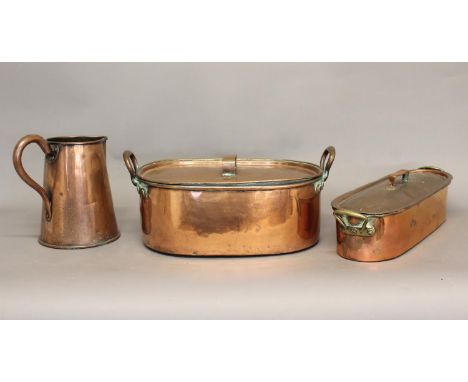 TWO VICTORIAN COPPER FISH KETTLES AND A SIMILAR JUG. A copper fish kettle with raised handles, the lid stamped with broad Gov