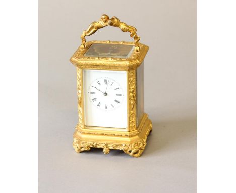 A GILT BRASS CASED CARRIAGE CLOCK BY BOLVILLER OF PARIS. With a rectangular white enamelled dial with Roman numerals, with a 