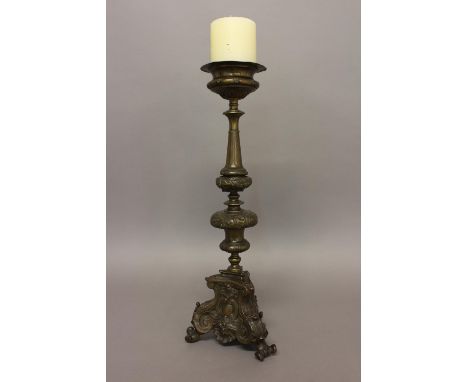 A MID 18TH CENTURY ITALIAN ALTAR CANDLESTICK. A baroque style candlestick with a flared drip pan on an elaborate floral decor