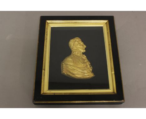 A GILT METAL RELIEF PROFILE PORTRAIT OF THE DUKE OF WELLINGTON. Side profile of the Duke with bare head wearing military unif