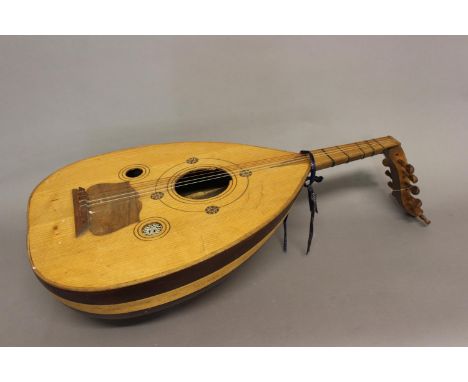 A RENAISSANCE STYLE LUTE. A full bodied Renaissance style lute with three sound holes, body with contrasting veneers, with tw