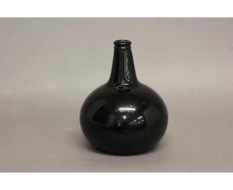 A LARGE 19TH CENTURY GREEN GLASS WINE BOTTLE. With a straight sided tapering neck and bulbous body, the underside with indent