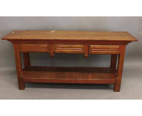 A RED STAINED SIDE TABLE AS MADE FOR LIBERTY AND CO. A 17th century style red stained side table with a rectangular top above