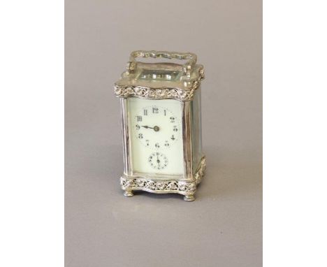 A 19th CENTURY SILVER PLATED CARRIAGE CLOCK. With a rectangular ivory effect dial with Arabic numerals, above a subsidiary al