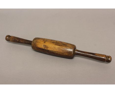 A VICTORIAN LABURNUM WOOD ROLLING PIN. Turned from a single piece of laburnum with a bulbous centre and two extended handles 