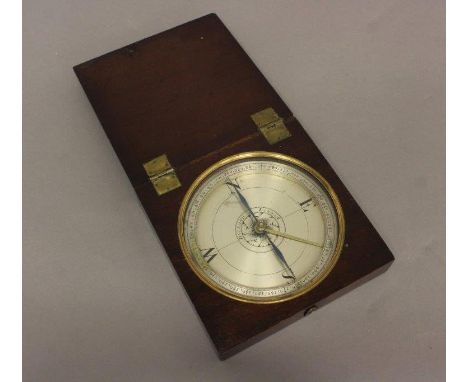 A TRAVELLING COMPASS BY DOLLOND OF LONDON. With a 12cm silvered dial, with a central flower surrounded by 'Dollond London' wi