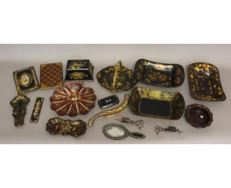 A COLLECTION OF PAPIER MACHE AND SIMILAR WARES. A Victorian papier mache swing handled cake plate, the surface decorated with
