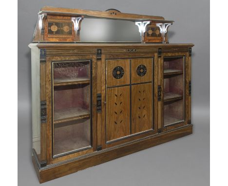 A VICTORIAN WALNUT AESTHETIC PERIOD SIDE CABINET BY H. OGDEN OF MANCHESTER. With a raised shelf and mirror back flanked by tw