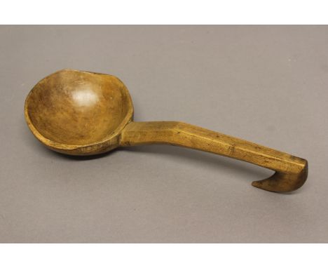 A WELSH SYCAMORE LADLE. Late 19th or early 20th century with a broad dished bowl on a shaped chamfered handle with hook end, 