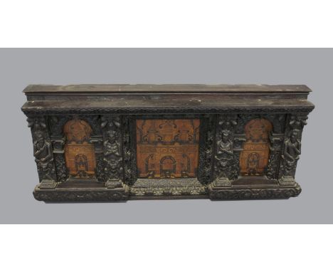 A 17TH CENTURY 'NONSUCH' BED HEAD OR OVERMANTEL PANEL. A fine carved and marquetry overmantel or part bedhead, with three mar