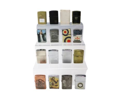 A group of vintage Zippo and other flip-top cigarette lighters