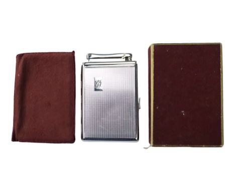 A boxed Colibri Monopol combination cigarette lighter and case