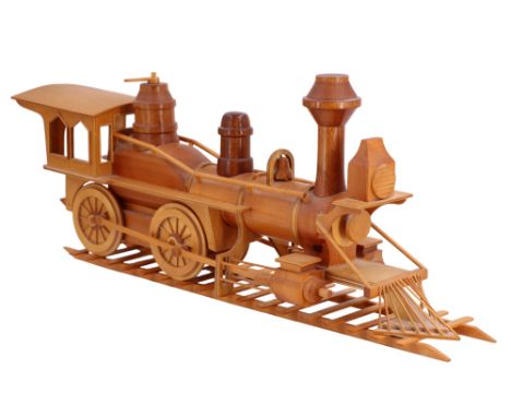 A wooden large-scale model of an American steam locomotive on track, 66 x 29 cm