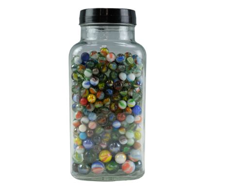 A large quantity of vintage and later glass marbles in a glass jar including cat eyes, etc