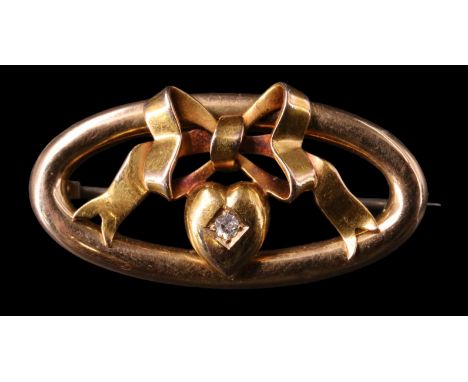 A Victorian diamond-set 15 ct gold brooch, having a 2mm eight-cut diamond set in heart surmounted by a tied bow in an openwor