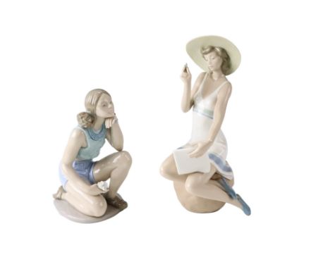 Two large Nao figurines depicting a young woman writing and another collecting flowers, tallest 30 cm