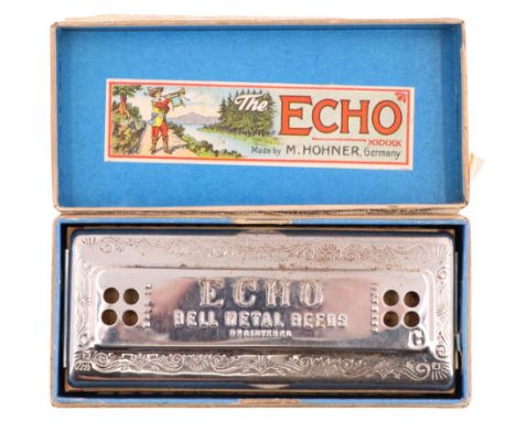 A 1920s M Hohner "The Echo" harmonica, in original carton