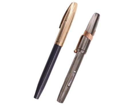 A vintage Sheaffer fountain pen with a 14 K nib, together with a similar Waterman's fountain pen