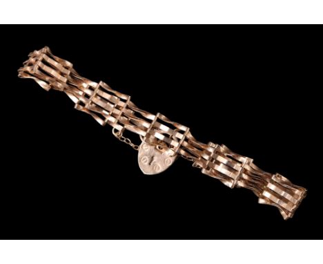 A 9 ct gold gate-link bracelet, Sheffield, 1991, 3.83 g, 8.5 mm wide, 17.5 cm excluding padlock clasp