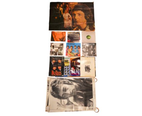 A large quantity of vintage and later posters and calendars pertaining to The Beatles, John Lennon, Paul McCartney, etc