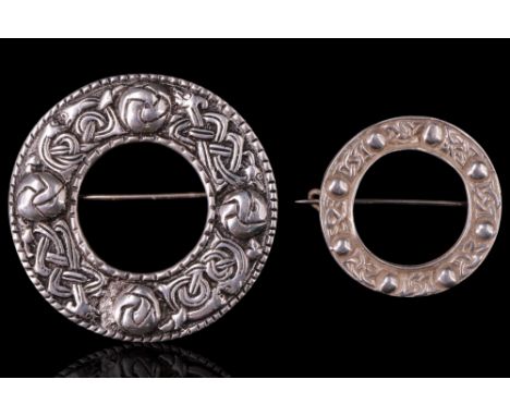A Celtic Art Industries Iona white metal annular brooch, relief decorated in patterns of Scottish interlace and bosses, toget