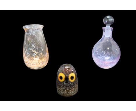 A Caithness mottled violet glass scent bottle having a ground in stopper, together with a similar Caithness vase and an Ittal