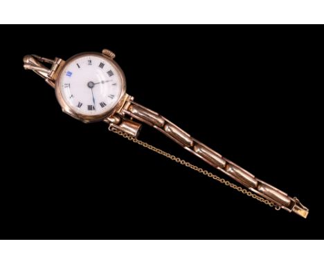 A 1920s 9 ct gold wristlet watch, having a crown wound movement, white enamel face, blued-steel poker hands and Roman numeral