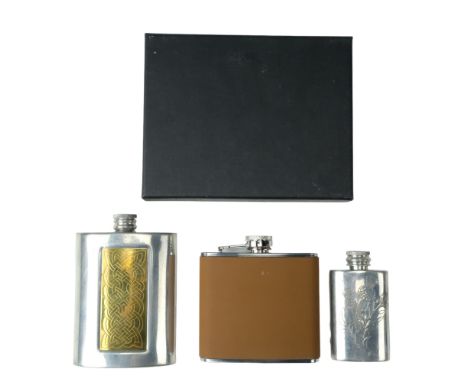 A Celtic design hip flask together with two other hip flasks