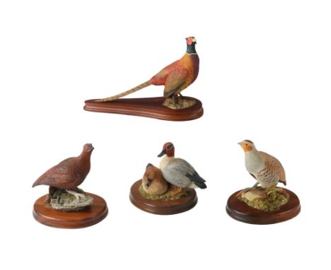 Three Wildtrack bird figurines together with a Caithness pheasant, latter 16 x 24 cm