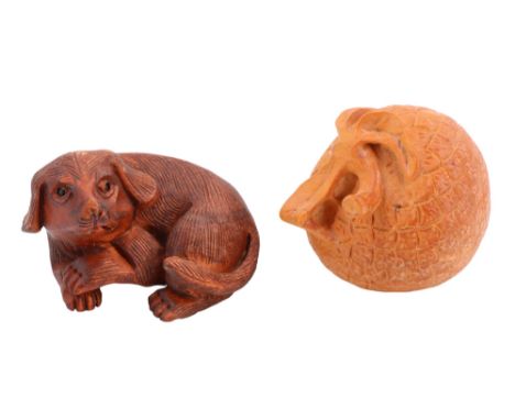 Two mid-to-late 20th Century netsuke carved in depiction of a dog and a lychee repsecively, lychee height 5 cm