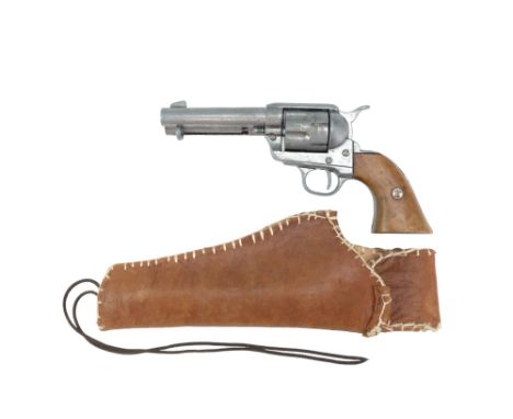 A vintage die-cast (non-firing) replica Colt Peacemaker revolver and leather holster