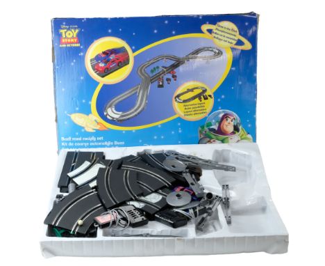 A boxed Disney Pixar " Toy Story and Beyond!" Buzz slot car racing set