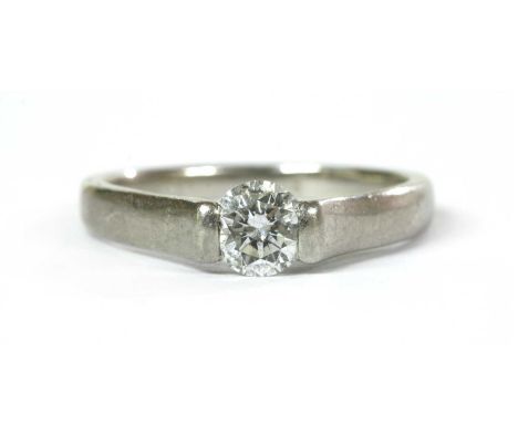 A platinum single stone diamond ring, with a brilliant cut diamond, with a stated weight of 0.47ct, end set to an open head, 